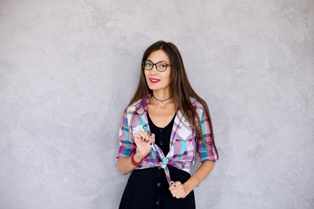 Hipster girl with glasses looking