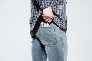 hipster laying condom in back pocket