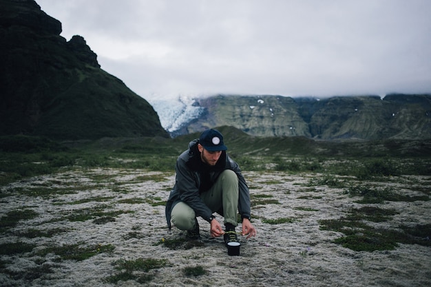 Hipster man hiking in iceland