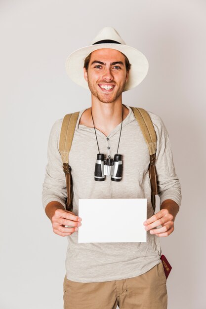 Hipster man holding blank paper