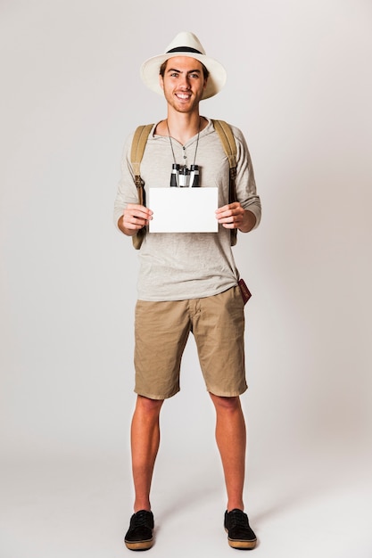Hipster man showing blank paper