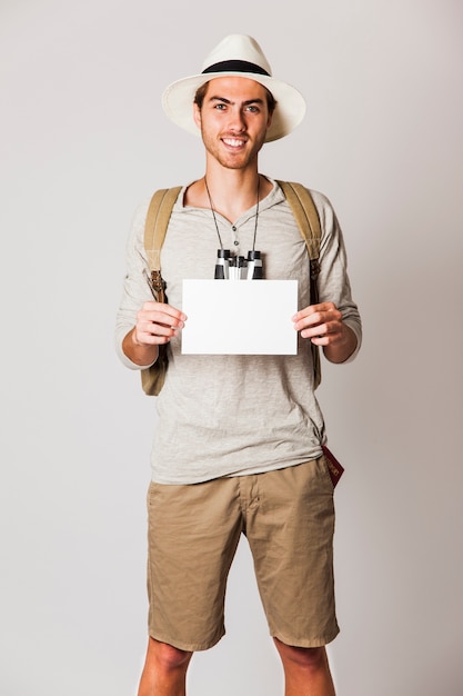 Hipster man showing paper