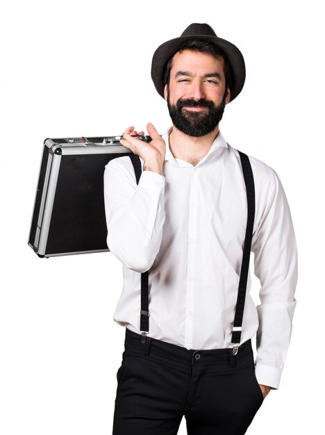 Hipster man with beard holding a briefcase