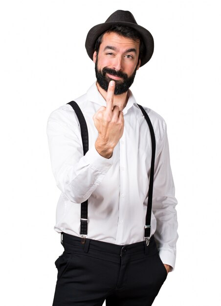 Hipster man with beard making horn gesture