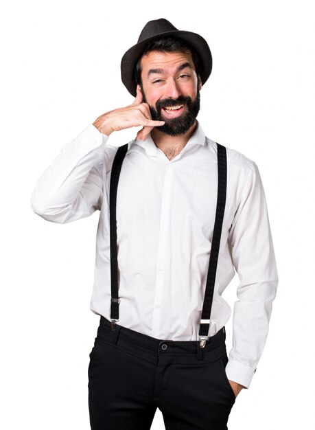 Hipster man with beard making phone gesture