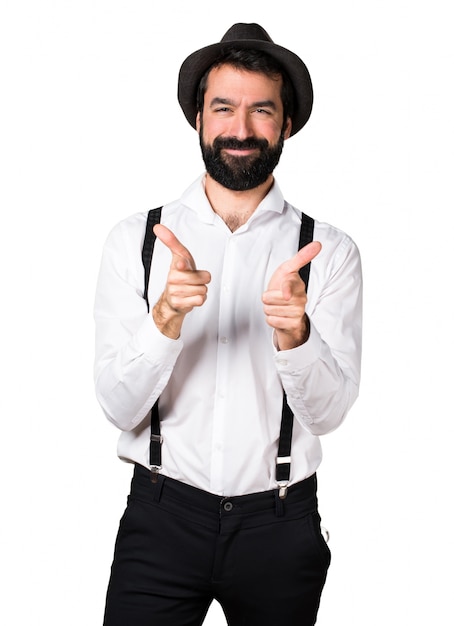 Hipster man with beard pointing to the front