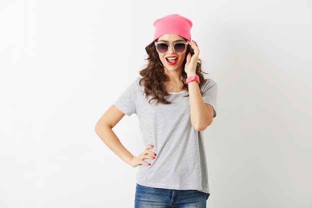 Hipster pretty woman in pink hat, sunglasses, smiling, isolated, white teeth, red lips, curly hair, wearing t-shirt