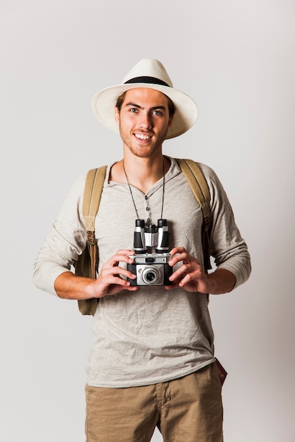 Free photo hipster style tourist holding camera