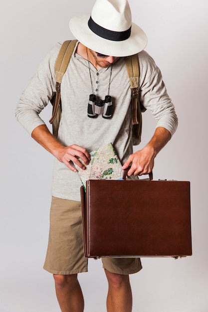 Hipster style tourist with suitcase