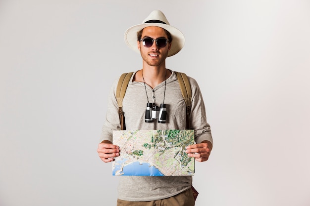 Free photo hipster traveler with sunglasses and map