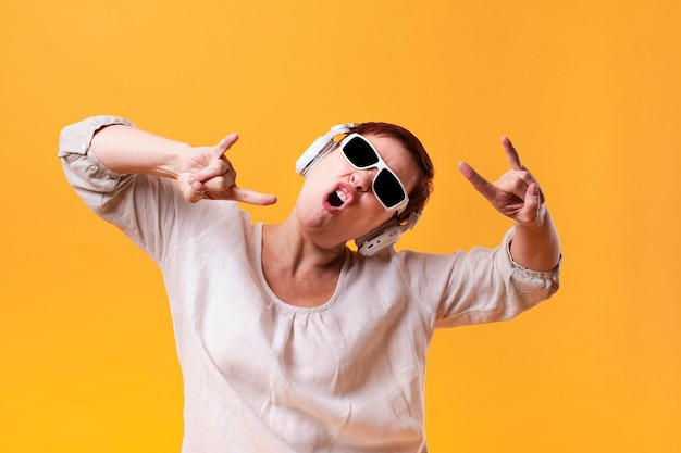 Hipster woman listening rock music