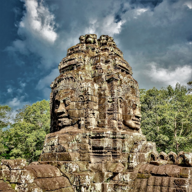 Historic statues at Angkor Thom, Siem Reap, Cambodia under the cloudy sky