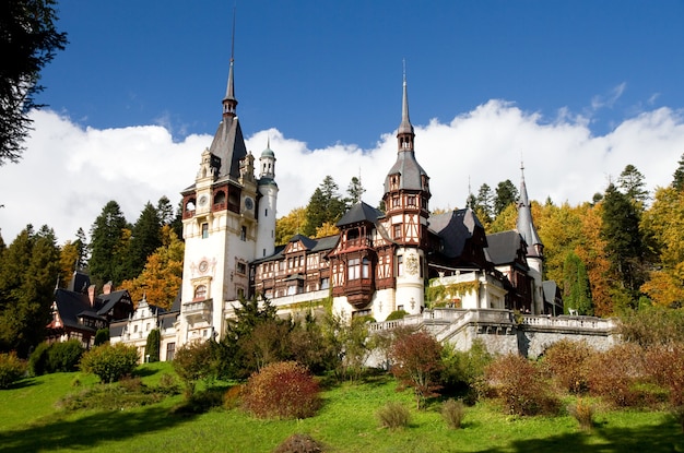 Historical Sinaia Monastery surrounded by green trees in Sinaia, Romania