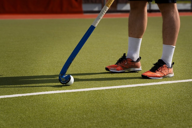 Free Photo hockey player during a match on the grass