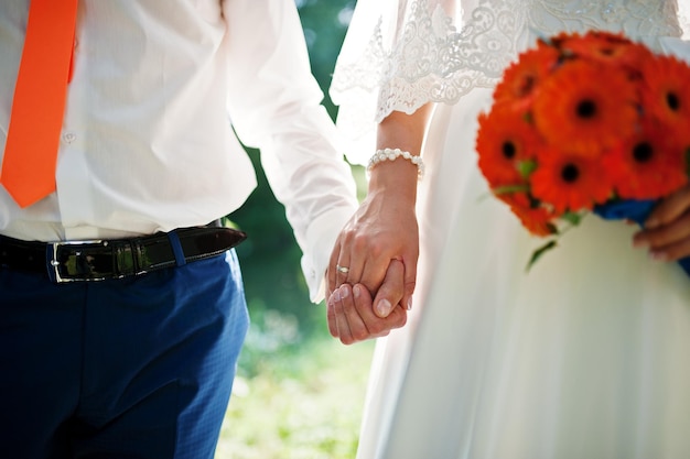 Holding hand in hand of wedding couple