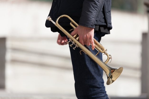 Holding trumpet side view