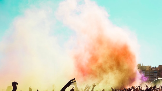 Holi color explosion over the crowd of people