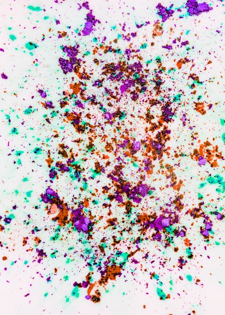 Holi color powder on white backdrop