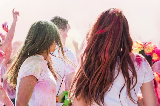 Holi color over the women enjoying with friends