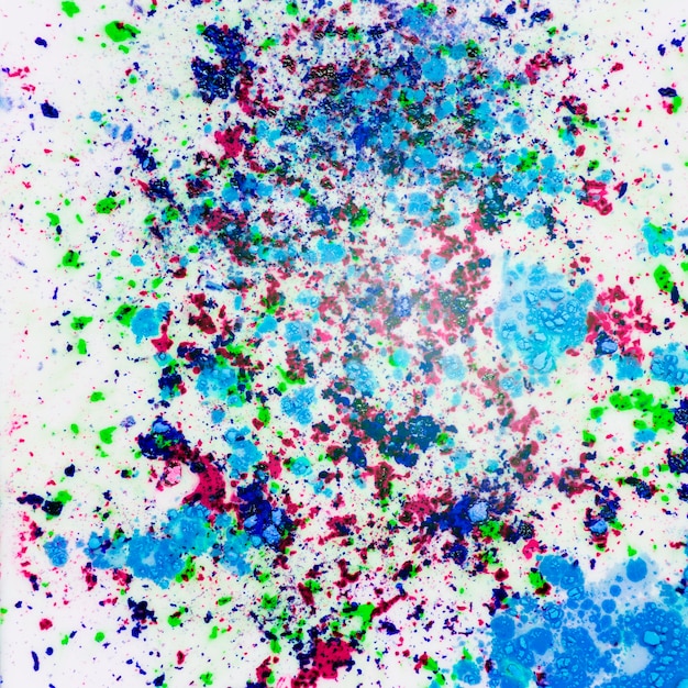 Holi colored powder splatter on white background