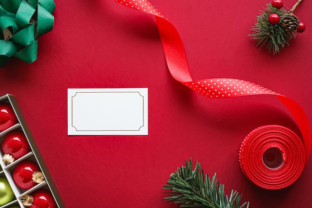 Holiday brand identity design and christmas flatlay concept white blank business card and xmas ornam...