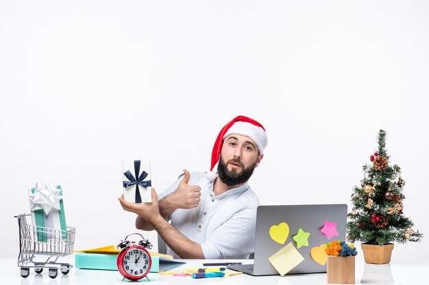 Holiday mood with young adult with santa claus hat working