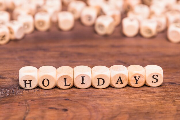 Holidays word made with wooden cubes