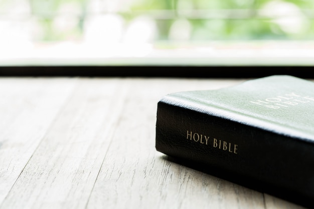 Holy Bible on a wooden table