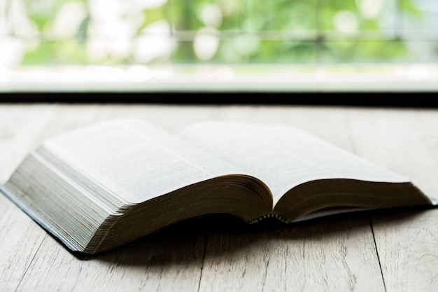 Holy Bible on a wooden table