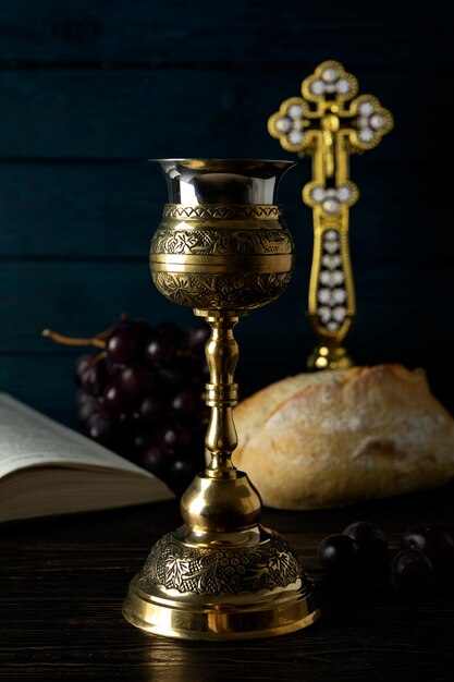 Holy communion with wine chalice and cross