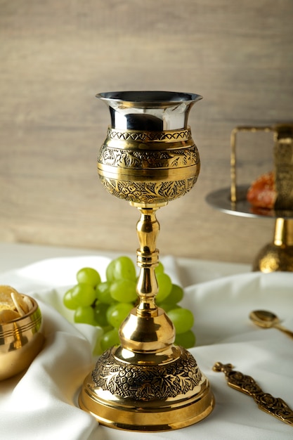 Free photo holy communion with wine chalice and grapes