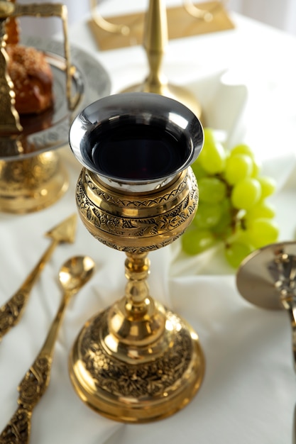 Holy communion with wine chalice high angle