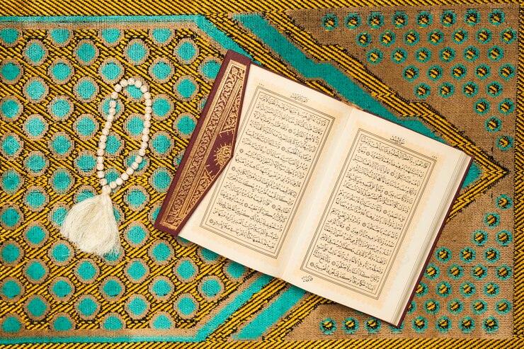 Free Photo holy mat with book and bracelet