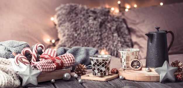 home comfort, details of the festive interior on a wooden table