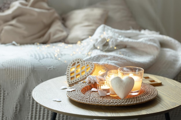 Free photo home composition for valentines day with candles in the interior of the room