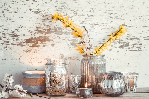 Home decor on wooden wall with spring flowers