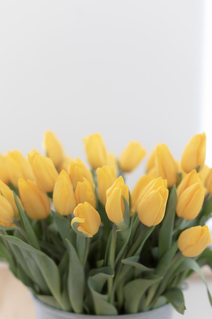 Home interior with a fresh bouquet of tulips