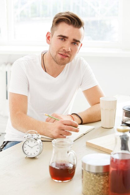 Home, morning. Man by the table