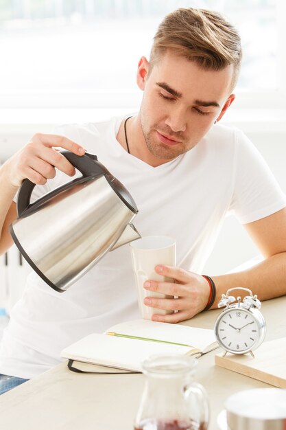 Home, morning. Man by the table