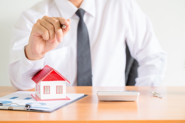 Home salesman stretches holding black pen,