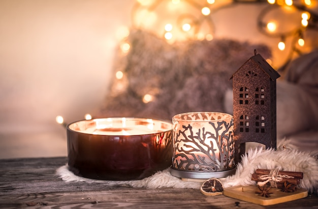 Free photo home still life in the interior with beautiful candles, on the table of a cozy home decor