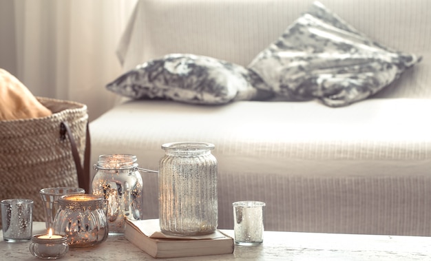 Free photo home still life with candles and vase in the living room