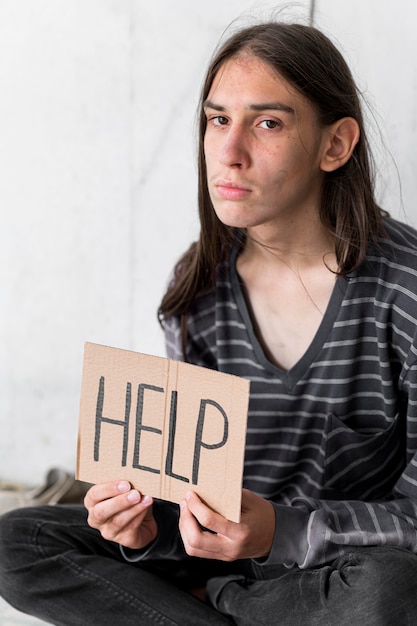 Free photo homeless man begging for help