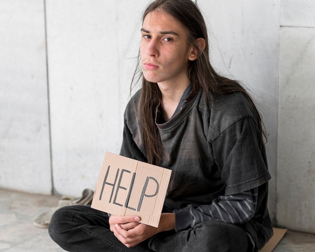 Free photo homeless person begging for help