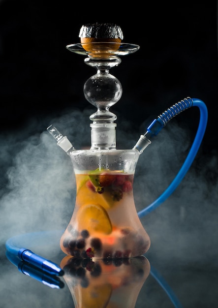 Homemade arabic shisha with mixed fruits and berries in a steam