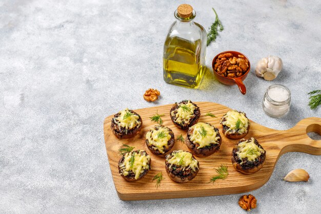 Homemade baked stuffed champignon mushrooms with fresh dill and Cheese
