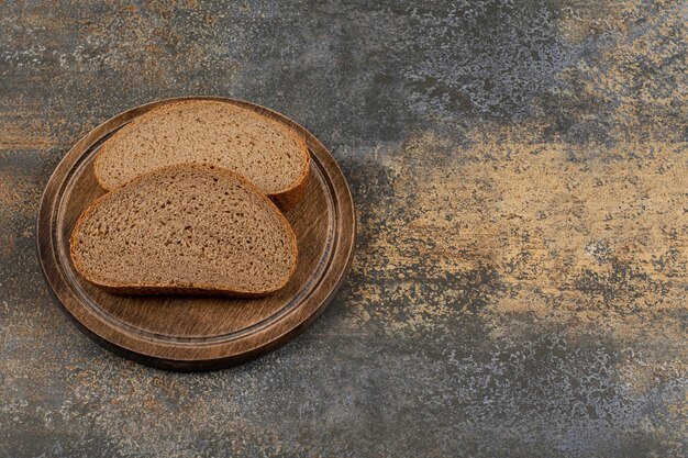 Homemade black bread on wooden board