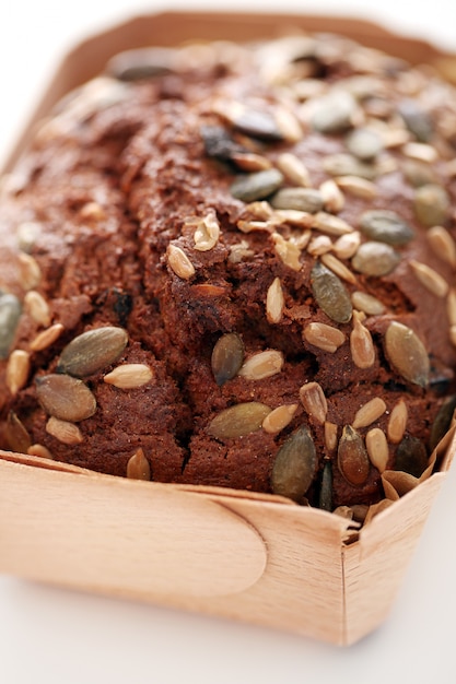 Homemade bread with grains in a box