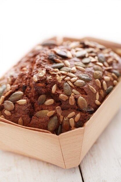 Homemade bread with grains in a box