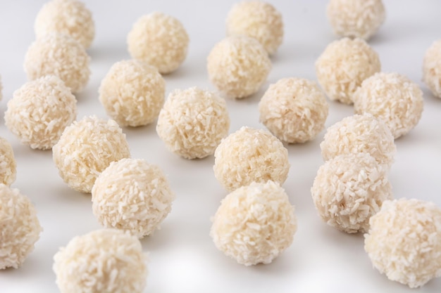 Free photo homemade coconut balls isolated on white background